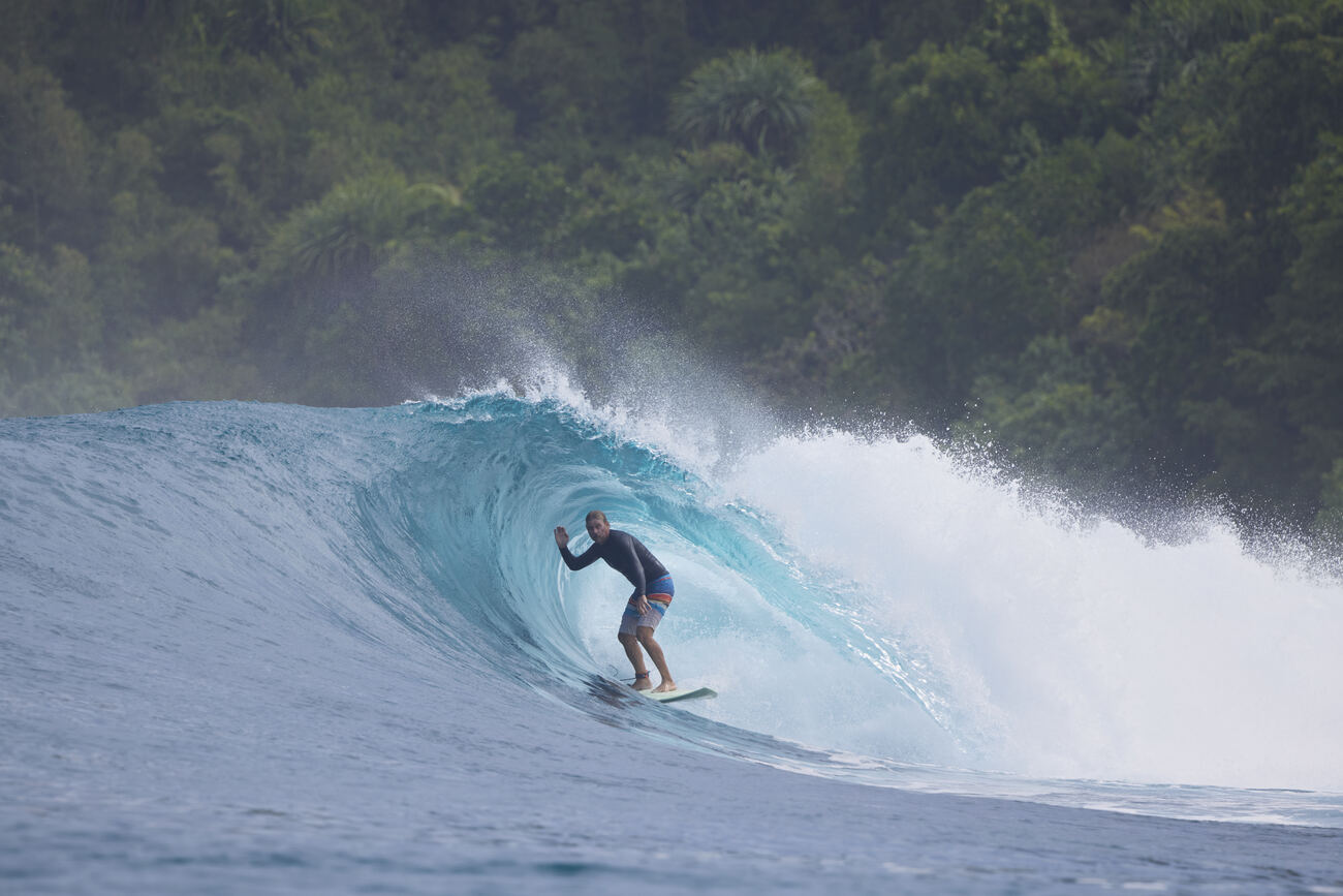 Surfer inside an emerald barrel at Treasures